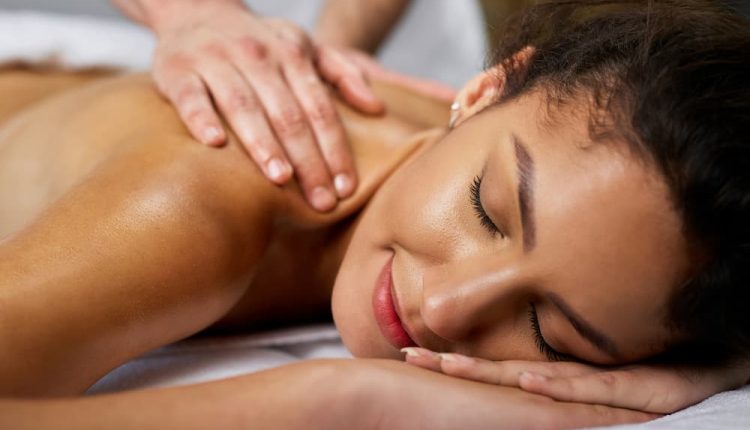 Closeup beautiful woman having back massage health spa